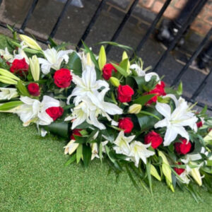 Red rose & Lily Double ended Coffin spray, a handcrafted funeral flowers by Flowers by Kerry Mac Manchester florist