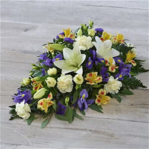 Lemon and Blue Spray, a handcrafted funeral & sympathy by Flowers by Kerry Mac Manchester florist