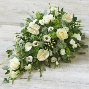 Deluxe white spray, a handcrafted funeral flowers by Flowers by Kerry Mac Manchester florist