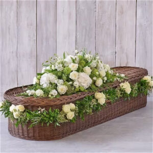 Large white Casket spray with Rose Garland, a handcrafted funeral & sympathy by Flowers by Kerry Mac Manchester florist