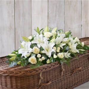 Lily & rose casket spray, a handcrafted funeral flowers by Flowers by Kerry Mac Manchester florist