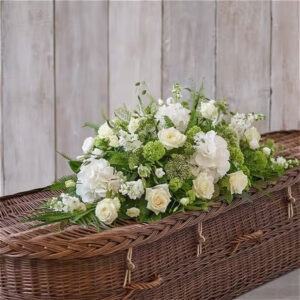 White casket spray, a handcrafted funeral flowers by Flowers by Kerry Mac Manchester florist