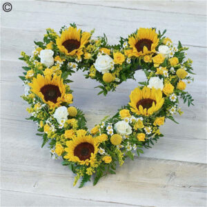 Striking Sunflower Heart, a handcrafted funeral flowers by Flowers by Kerry Mac Manchester florist